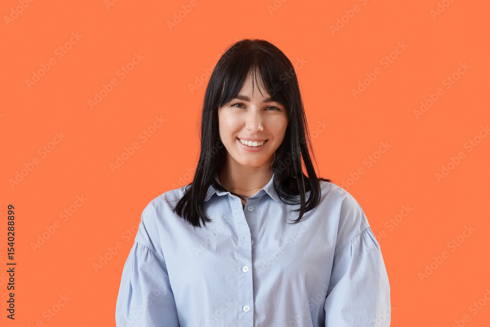 Young woman with beautiful smile on orange background Young woman with beautiful smile on orange background