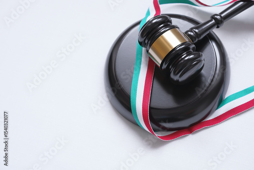 Italy Law And Legal System Concept With Judge Gavel And Italian Flag On A Ribbon