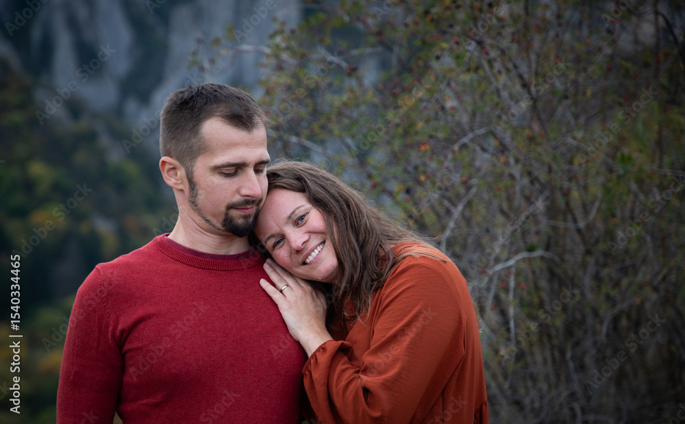 Fototapeta premium happy young couple posing outdoors in autumn