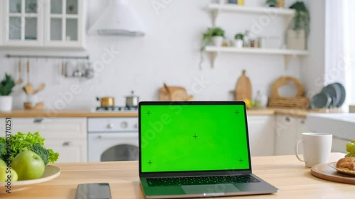 Laptop green screen kitchen counter