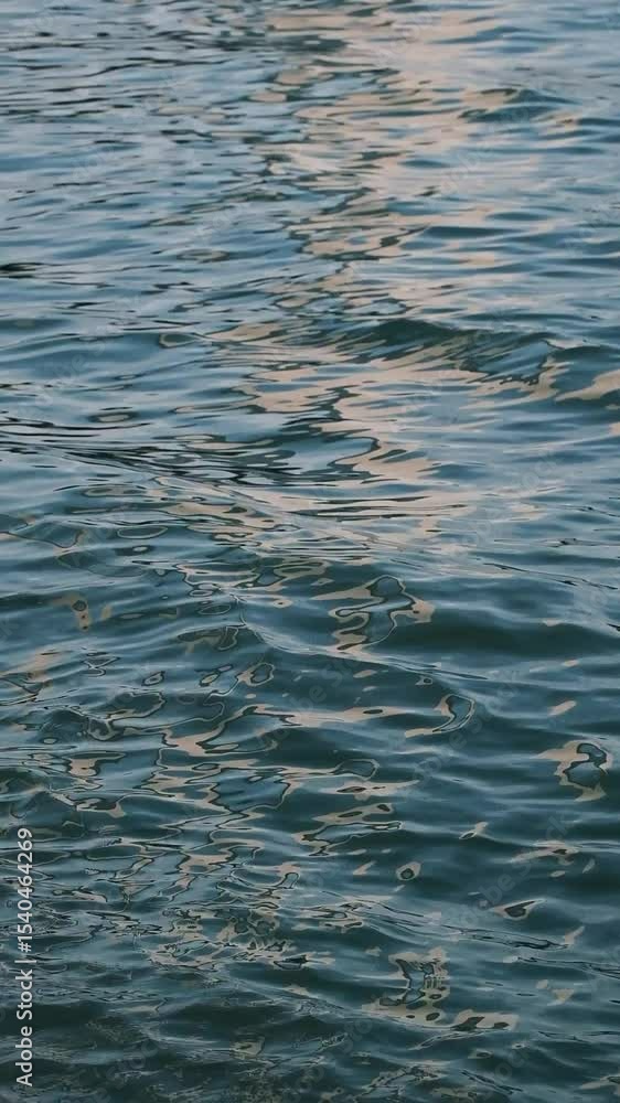 Golden blue sparkling water under the sunset Golden blue sparkling water under the sunset