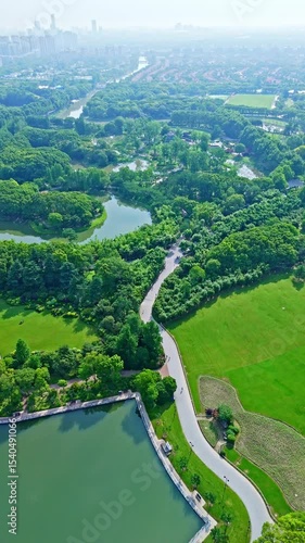 4k Real time Aerial view of Shanghai Century Park in Pudong on sunny day