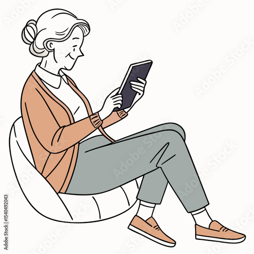 Senior woman relaxing using tablet comfortable chair