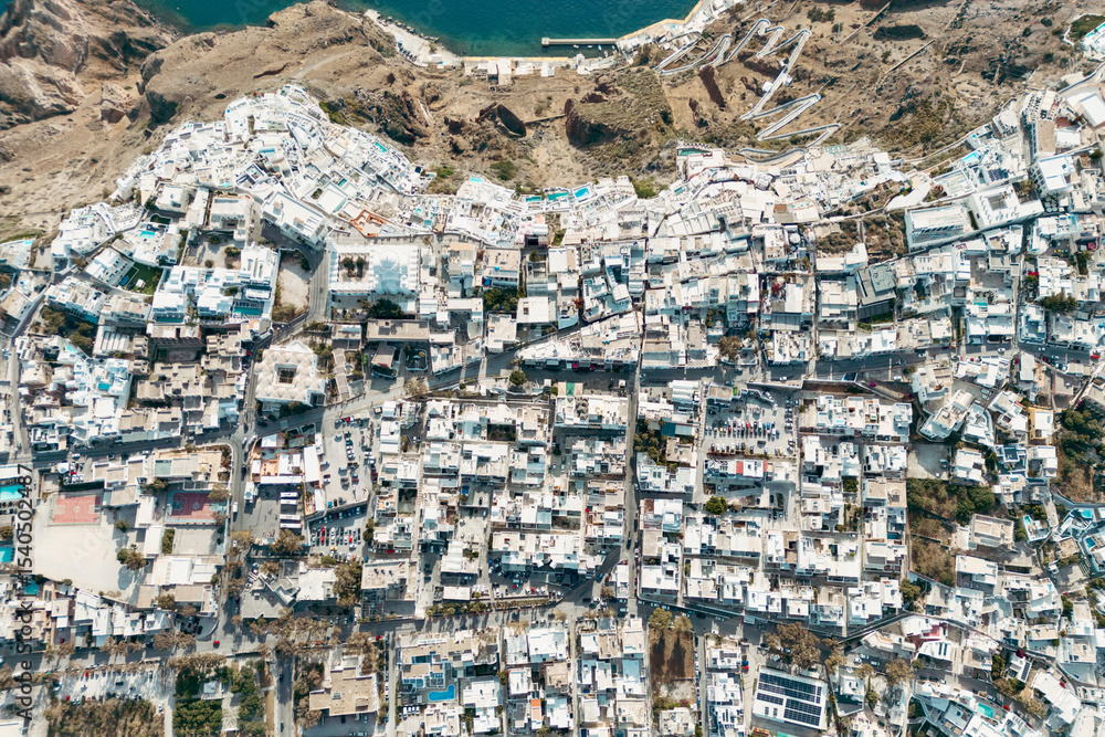 Naklejka premium Aerial drone photo of beautiful Fira town on Santorini with white houses and dense layout