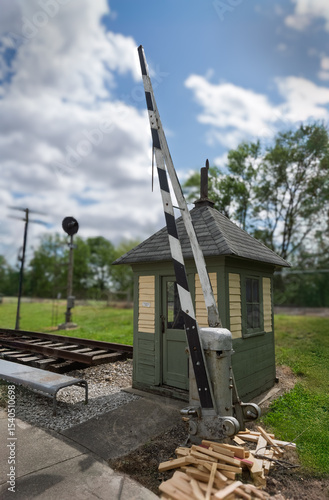 Old railroad crossing gate and shack