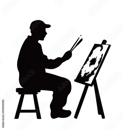 Silhouette of a male artist painting on an easel, capturing creativity and passion.