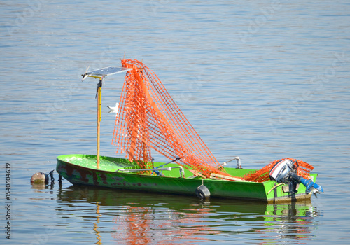 green boat with solar panel