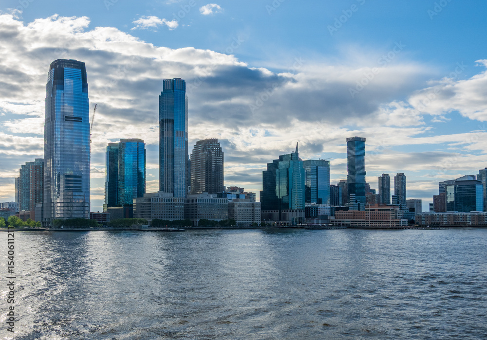 Fototapeta premium City Skyline of Jersey City seen from the Hudson river in the later afternoon