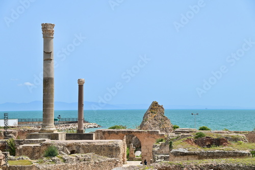 Ancient Roman Stone Columns and Arches at the Baths of Antoninus in Carthage, a Heritage Site in Tunisia