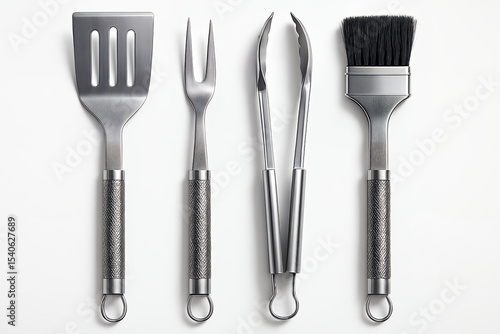 A collection of stainless steel grilling tools, including a spatula, fork, tongs, and basting brush, arranged on a white background.