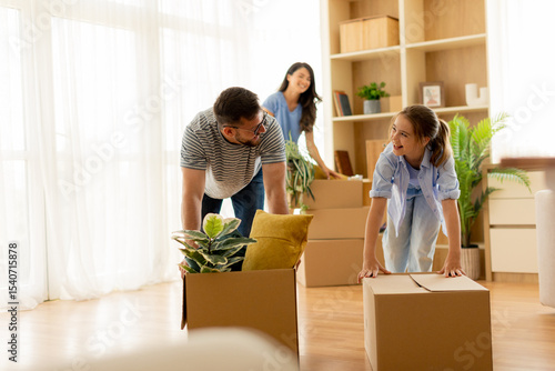 Family enjoys unpacking box...