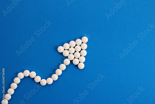 Arrow going up, aspirins to improve blood circulation