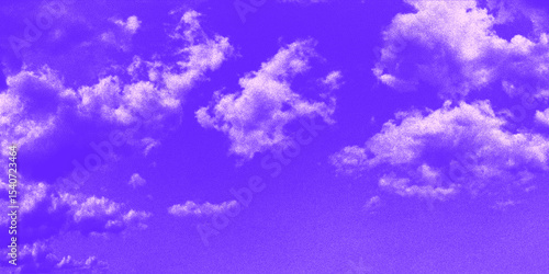 Vibrant purple sky with halftone effect and soft clouds creating an artistic atmosphere at dusk.