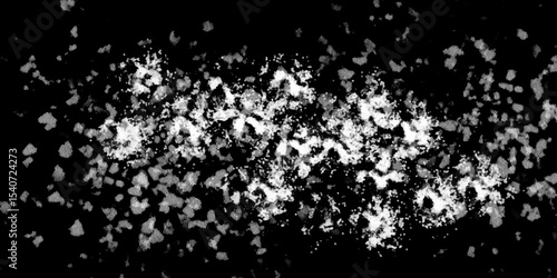 Snowflakes on dark background. white icy snowflakes isolated on black background, natural background. white crystalline powder on a black background. sugar dust. texture, pattern and clipping.