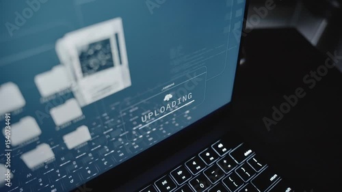 Close up on laptop computer screen uploading top secret documents to server. Online remote connection stealing government classified confidential information files copying to cloud by spy or insider