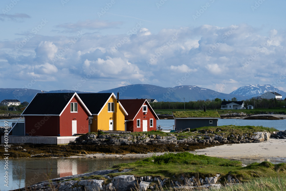 Sommaroy Norway. Three buildings in summer evening light Sommaroy Norway. Three buildings in summer evening light