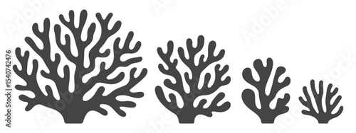 Three stylized silhouettes of sea kelp or coral in varying sizes