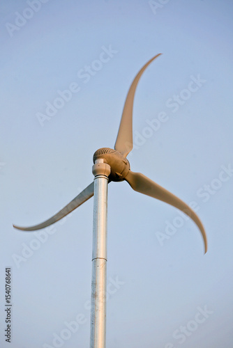 wind turbine against blue sky