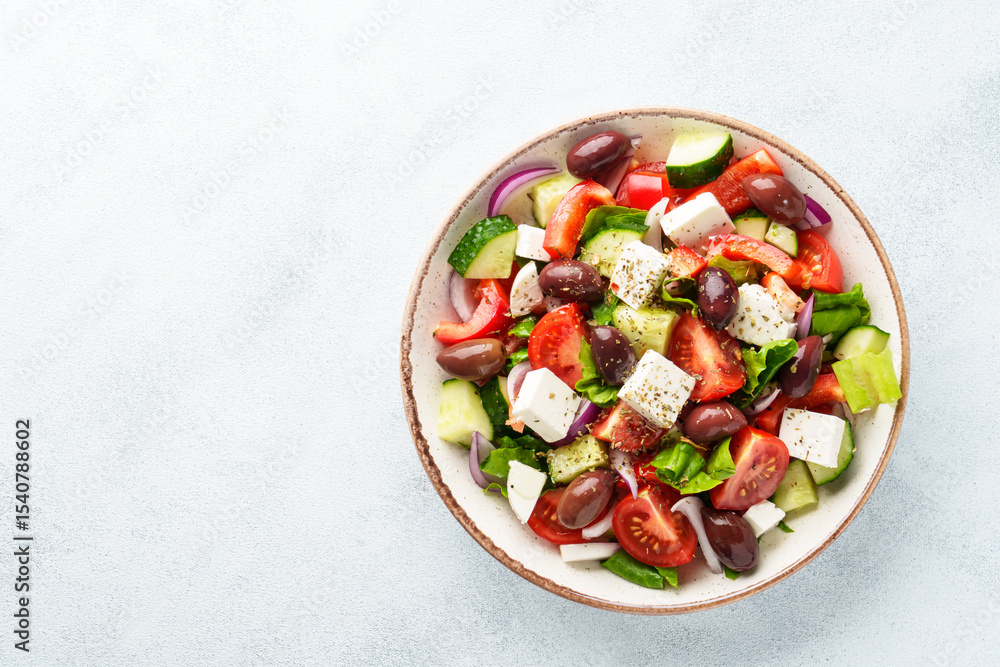 Greek salad, healthy food, mediterranean diet. Fresh vegetables, cheese and olive oil. Greek salad, healthy food, mediterranean diet. Fresh vegetables, cheese and olive oil.