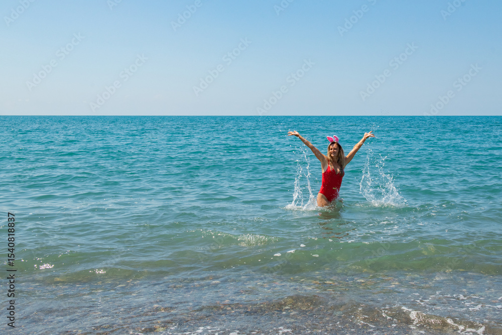 Yuletide Beach Bliss: Red Swimsuit and Santa Hat by the Shore Yuletide Beach Bliss: Red Swimsuit and Santa Hat by the Shore