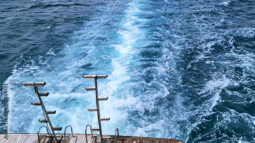 Private yacht view of cruise ship engine tracks in deep blue water with white foam. Relaxing travel concept, warm Red Sea scenery. Voyage and leisure theme, Serene maritime travel atmosphere