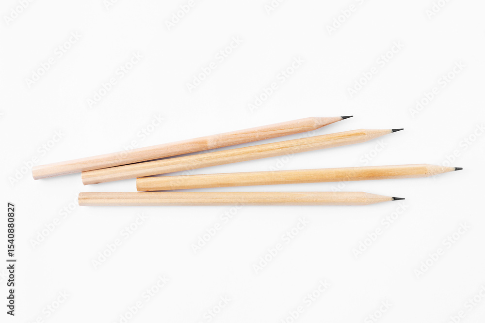 Many graphite pencils on white background, flat lay Many graphite pencils on white background, flat lay
