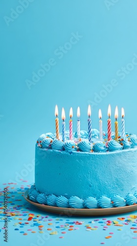 Celebrating a Blue Cake With Lit Candles During a Birthday Party in a Cozy In...