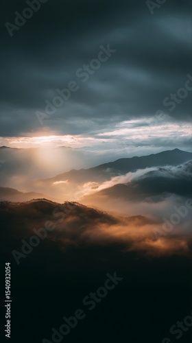 Stunning View of Mountain Range Above Clouds at Sunrise With Soft Light Illum...