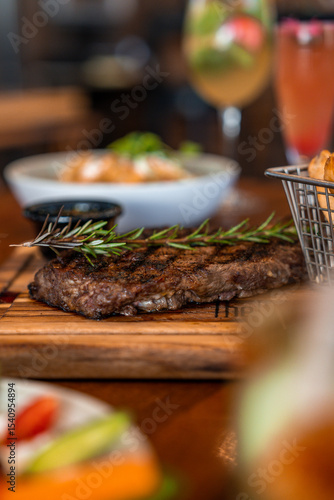 A steak with rosemary