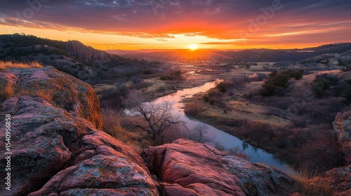 Orange-crimson sunset over the valley at Wichita mountains wildlife refuge near Lawton, Oklahoma