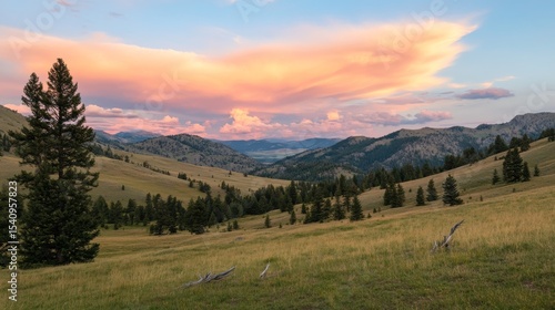 Golden hour sunset with vibrant blue and orange clouds over Montana's expansive big sky landscape