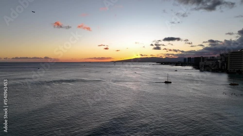 Waikiki Sunset with sailboats returning to shore