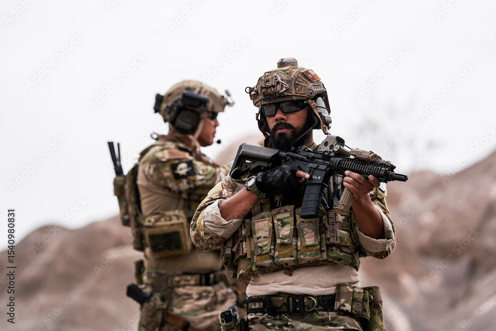 Fototapeta premium Special Forces Soldiers Armed and Ready During Tactical Training – Focused Military Men in Camouflage Uniform, Holding Assault Rifles, Outdoor Combat Operation in Desert Terrain