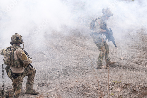 Fotografie Special Forces Soldier Standing in Smoke During Tactical Operation – Full Combat