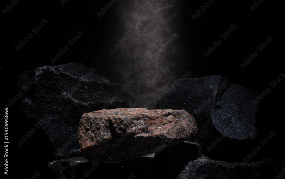 Fototapeta premium composition of stones for podium background.natural black stones with texture on dark background in minimalistic composition for presentation of cosmetics medicine fragrances jewelry products