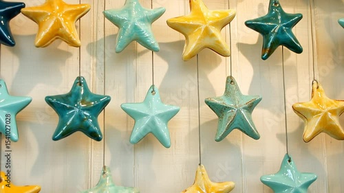 Colorful Ceramic Stars Hanging on a Wooden Wall in a Bright Space Generative AI