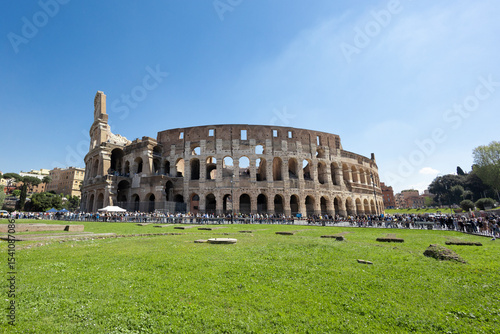 Viewpoint from the gardens of the Arch of Titus, of the Roman Colosseum, on a sunny day