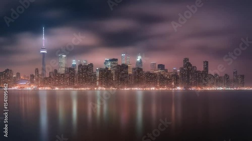 Night city skyline with glowing reflections across calm river water
