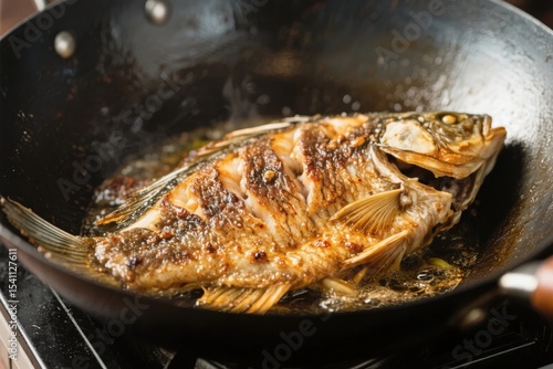 Frying a Whole Fish in a Wok with Oil and Seasonings