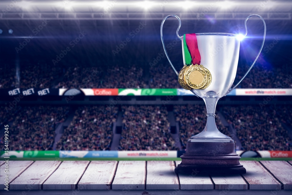 Fototapeta premium Trophy with medals at illuminated stadium