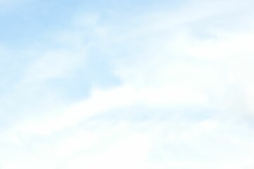 Flat design sky illustration is showing soft white clouds floating across pale blue background