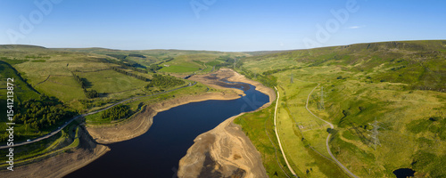 Aerial view of a dramatically low Woodhead Reservoir during drought conditions, The reservoir, part of a system supplying drinking water to Greater Manchester, lies in North Derbyshire, June 2025