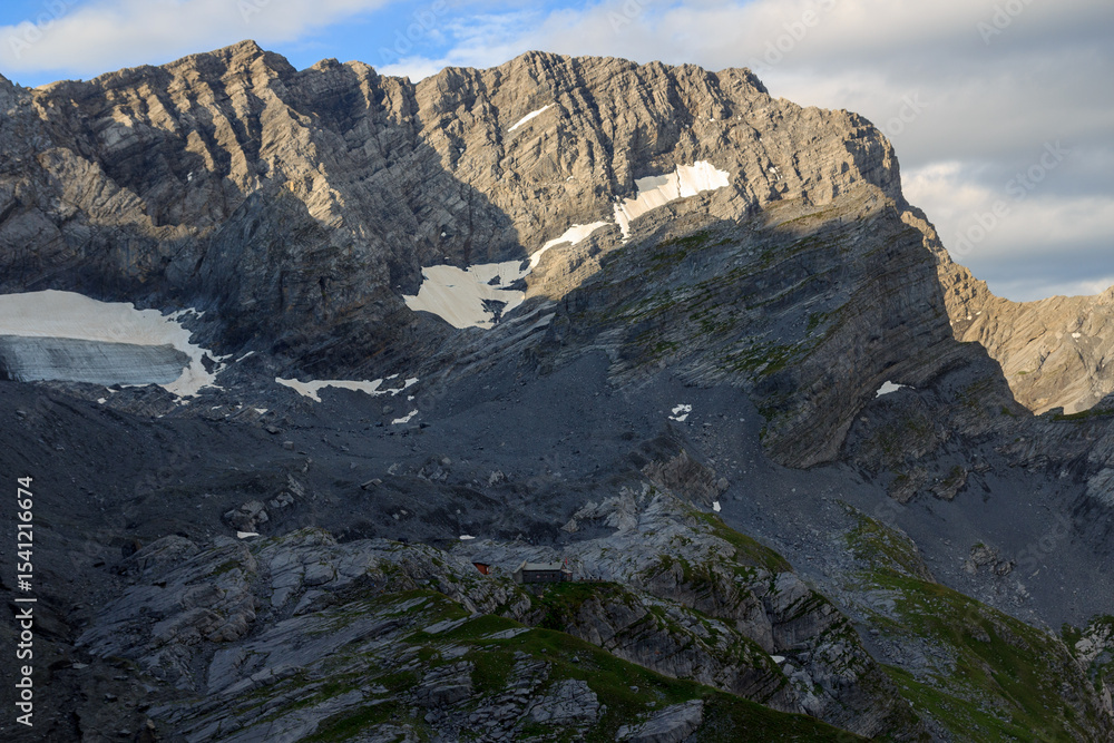 Fototapeta premium Mountain panorama with summit Grand Muveran and alpine hut Cabane de Plan Neve in Swiss Alps, Switzerland