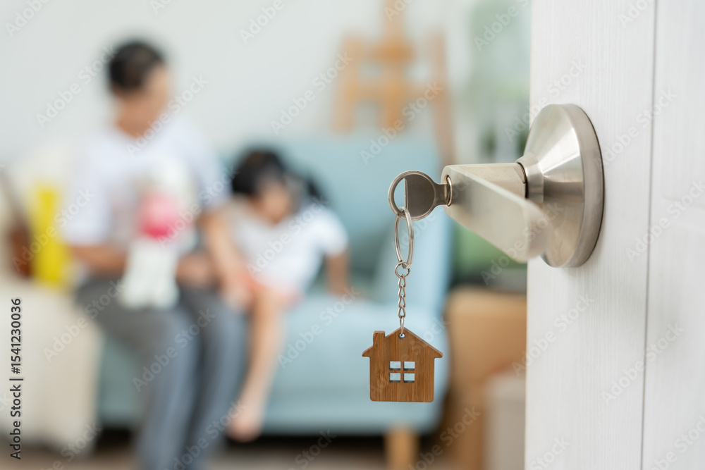 Fototapeta premium Moving house, relocation. Open the door found Family smile and play on new house, inside the room was a cardboard box contain personal belongings and furniture. move in the new apartment or home.