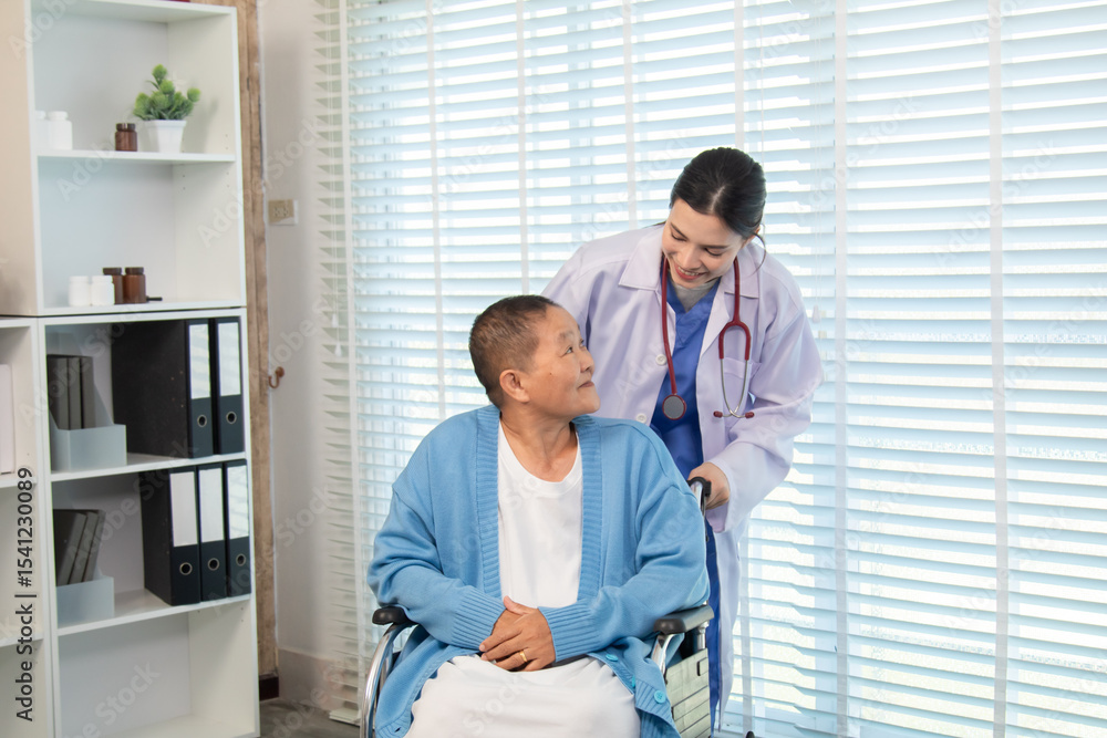 Obraz premium Doctor gently touching shoulder of older woman in wheelchair, expressing support, encouragement, and compassionate communication in warm indoor setting, healthcare, check. medical, examination.
