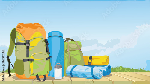 Camping gear including backpacks, water bottles, and rolled mats arranged on a wooden surface outdoors