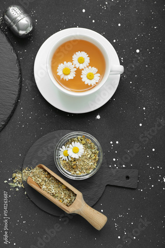 Chamomile tea cup with fres...