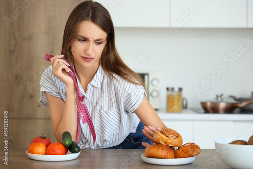 Young woman with measuring ...