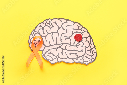 Paper brain and orange ribb...