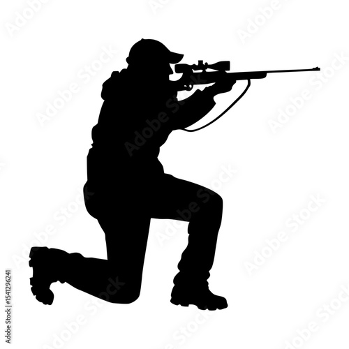 Silhouette of a hunter aiming a rifle while crouching